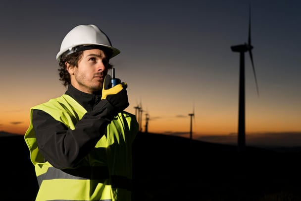 Person Standing on wind farms fields