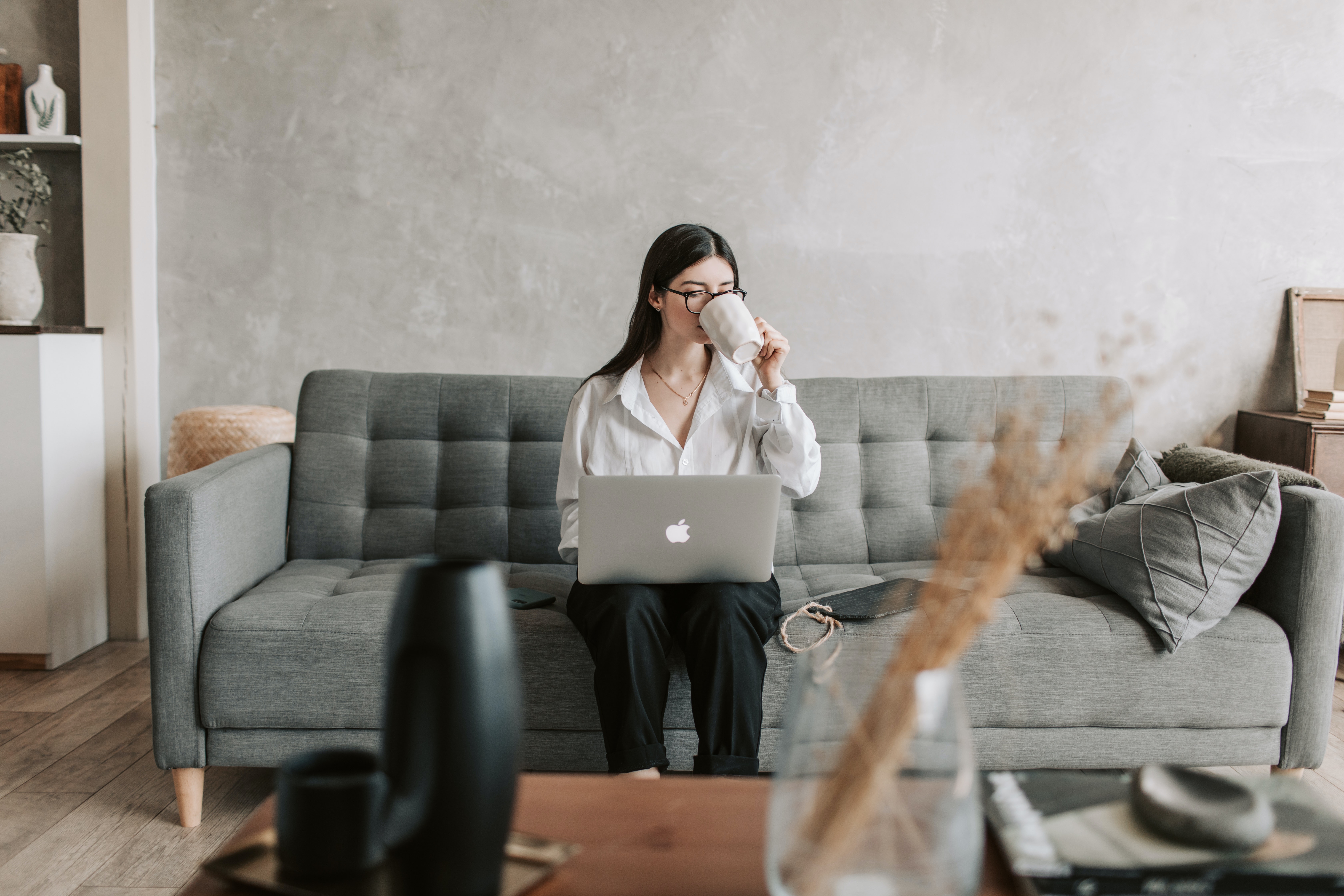 Woman Working At Home Using Laptop